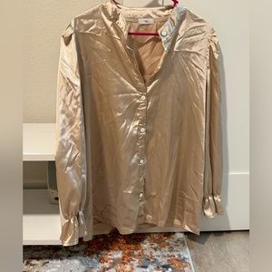 A golden satin shirt new worn brand new